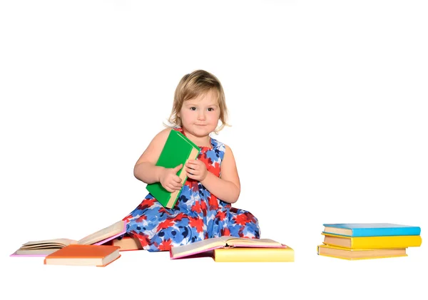 Kleines Mädchen mit farbigen Büchern — Stockfoto