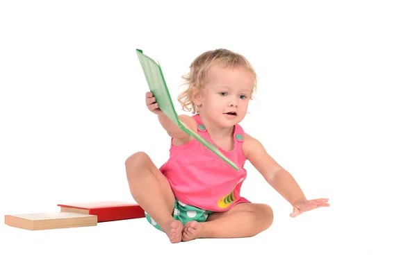 Petite fille avec des livres colorés — Photo