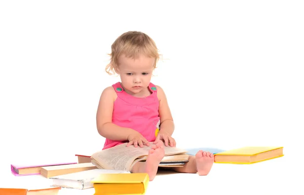 Kleines Mädchen mit farbigen Büchern — Stockfoto