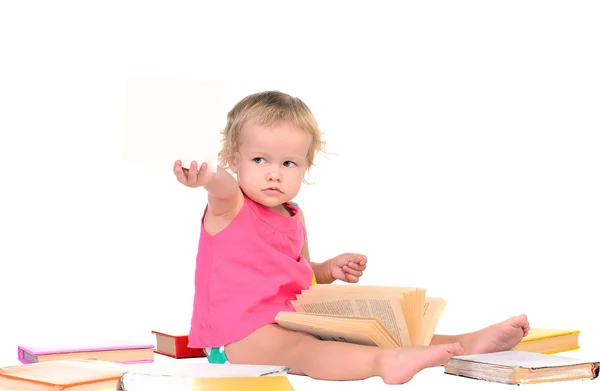 Liten flicka med färgade böcker — Stockfoto