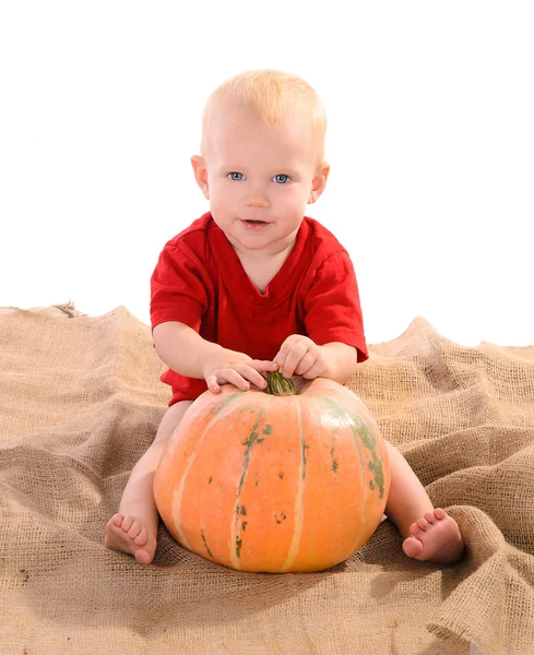 Child with orange pumpkin — Stock Photo, Image