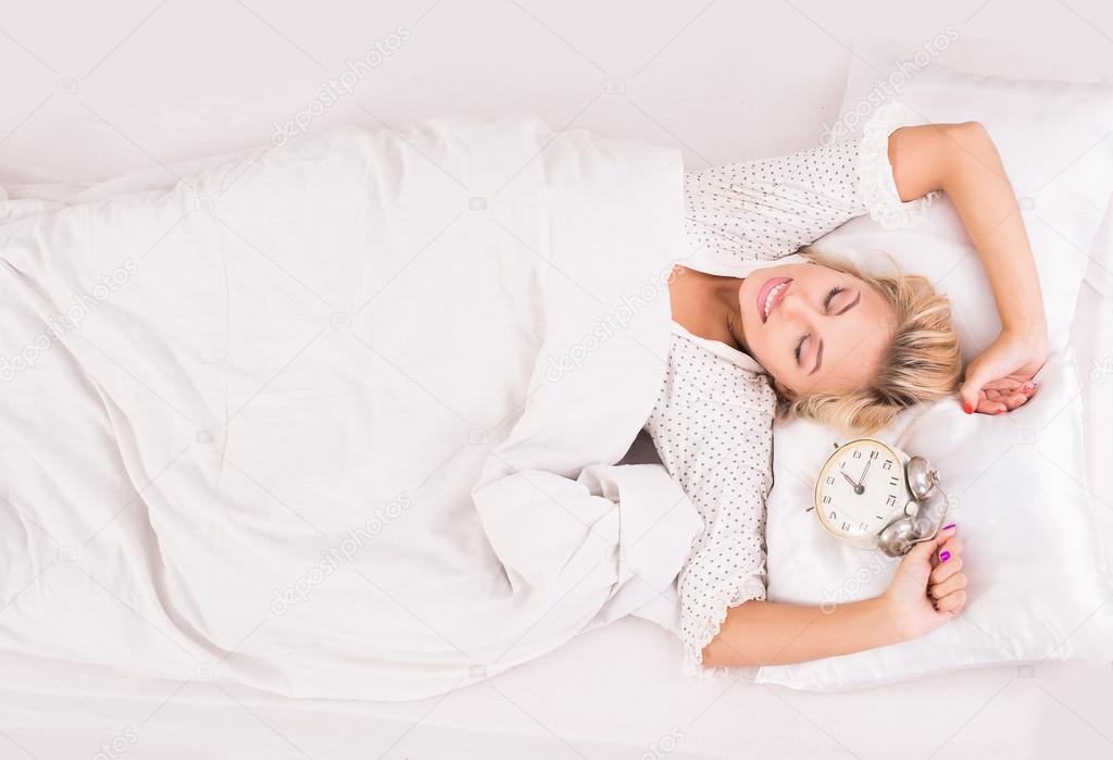Young beautiful woman in bed