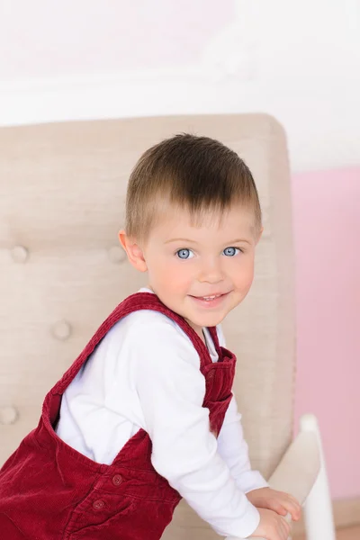 Portrait of little boy on armchair — Zdjęcie stockowe