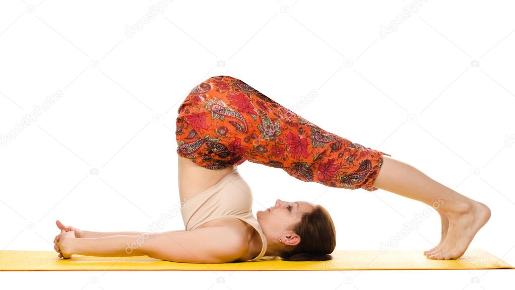 female yogi practising yoga exercises