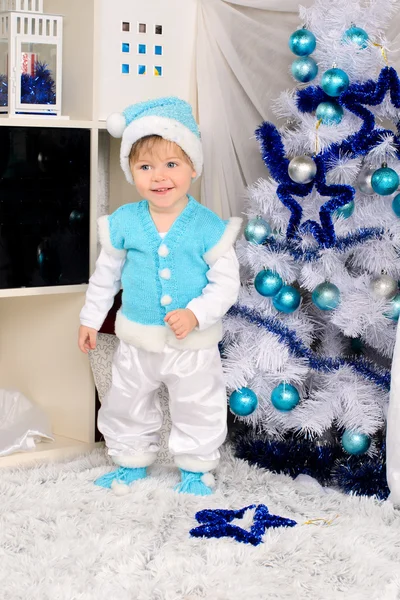 Little child in christmas interior in blue — Stock Photo, Image