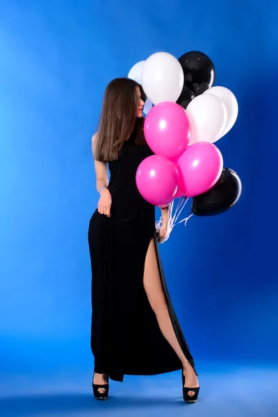Woman with black, white and pink balloons Stock Image