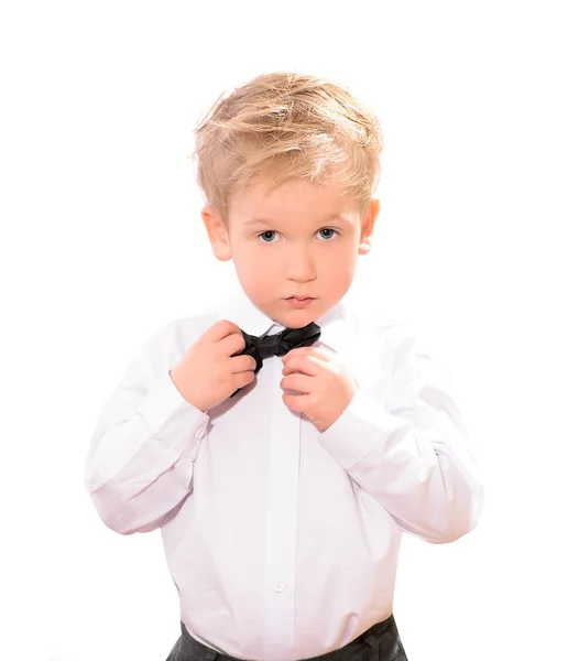 Chico rubio en camisa blanca con pajarita negra — Foto de Stock