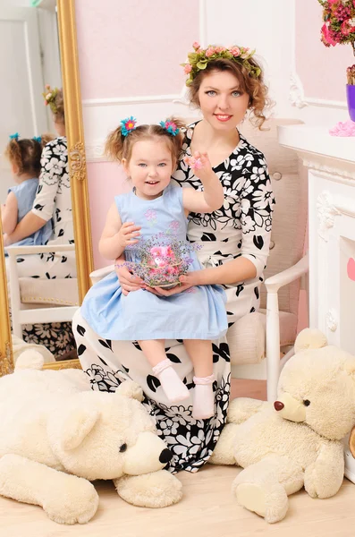 Mommy and daughter with soft toys — Stock Photo, Image