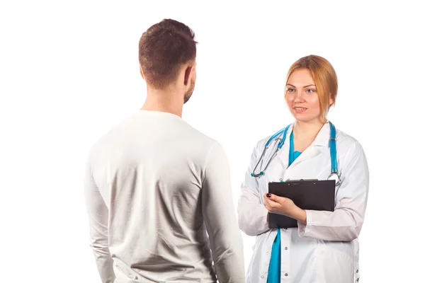 Female doctor holding application form while consulting patient. — Stock Photo, Image