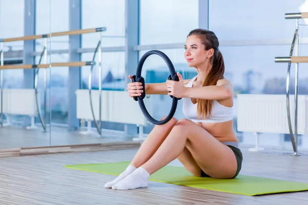 Pilates woman magic ring exercise workout at gym indoor — Stock Photo, Image