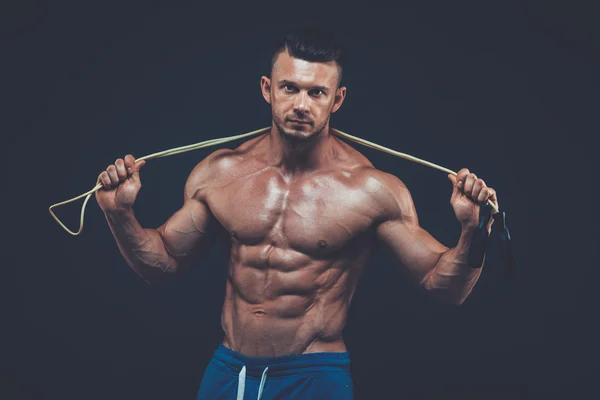 Muscular man skipping rope. active  sport  fitness — Zdjęcie stockowe