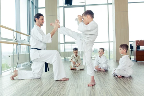 Young, beautiful, successful multi ethical kids in karate position — Stock Photo, Image