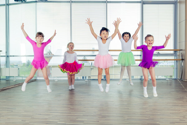 happy children dancing on in hall, healthy life, kids togetherness and happiness concept