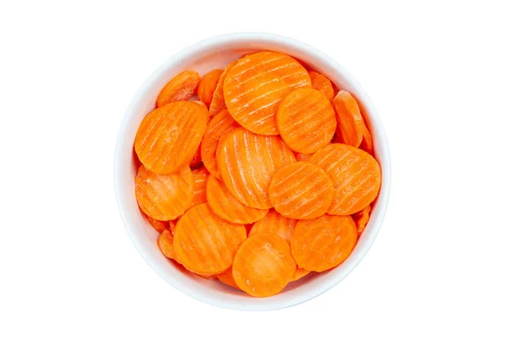 Top view of frozen sliced carrots in a bowl against white background — Stock Photo, Image