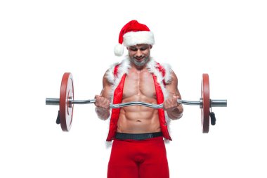 Seksi Noel Baba. Vücut geliştirici genç yakışıklı noel baba kılığında gülümseme kasları çalıştıran kollar ve pazılar yeni yıl arifesinde ve Noel tatilinde beyaz arka plan.