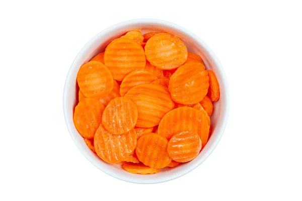 Top view of frozen sliced carrots in a bowl against white background — Stock Photo, Image