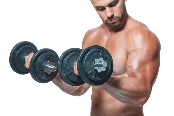 Sexy athletic man is showing muscular body with dumbbells standing with his head down, isolated over white background — Stock Photo, Image