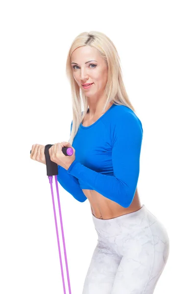 Side view of blonde fitness girl exercising with fitness expander isolated on white background — Stock Photo, Image