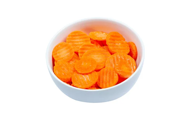 Top view of frozen sliced carrots in a bowl against white background — Stock Photo, Image