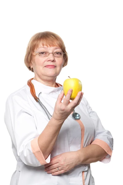 Medical doctor woman smile with stethoscope hold dreen fresh apple in hand. Isolated over white background — Stock Photo, Image