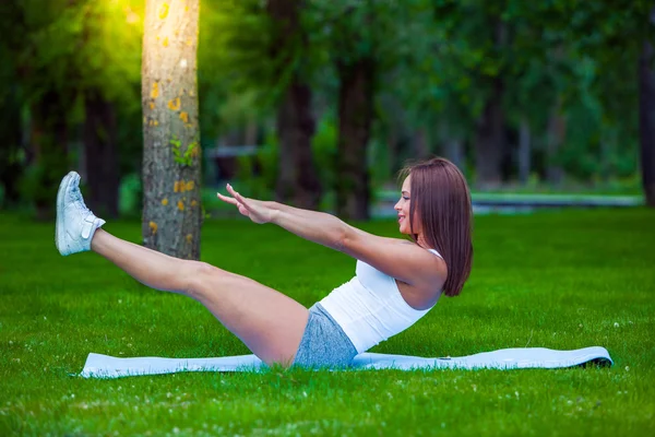 Fitness and lifestyle concept - woman doing sports outdoors — Stock Photo, Image