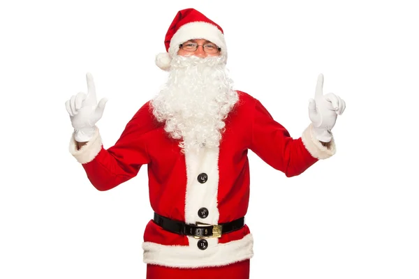 Papai Noel apontando sinal com sorriso, isolado no fundo branco — Fotografia de Stock
