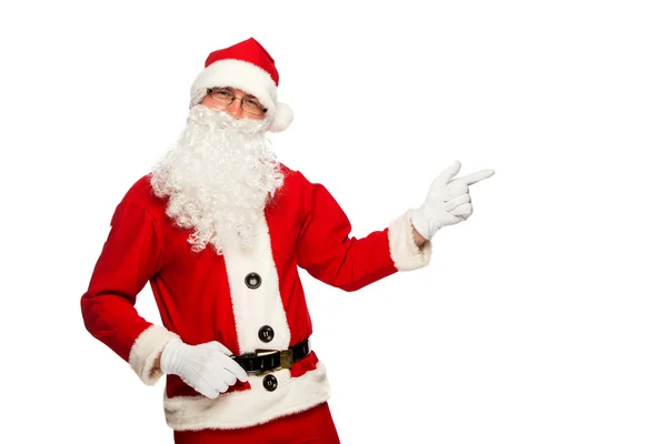 Santa Claus pointing sign with smile, isolated on white background Stock Photo