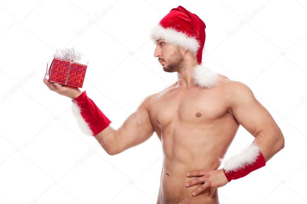 Image of sexy man wearing santa claus costume, isolated on white