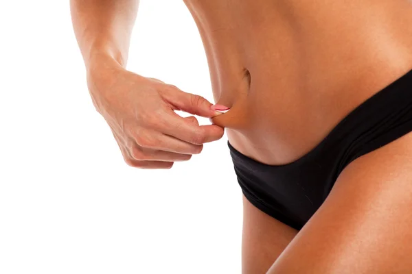 Estómago de mujer deportiva, aislado sobre fondo blanco —  Fotos de Stock