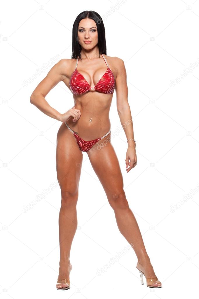 Full length photo of sporty woman in bikini isolated against white background