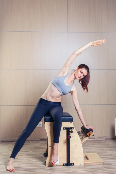 Combo wunda pilates chair woman fitness yoga gym exercise — Stock Photo, Image