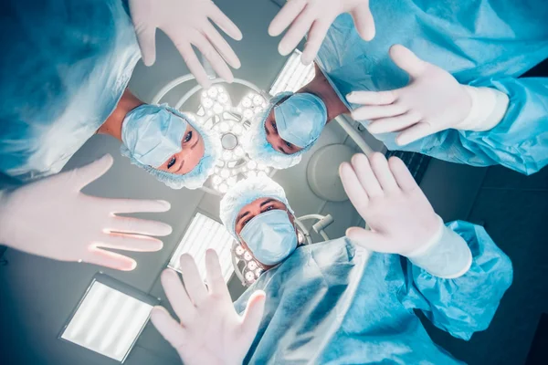 Surgeons standing above of the patient before surgery — Stock Photo, Image