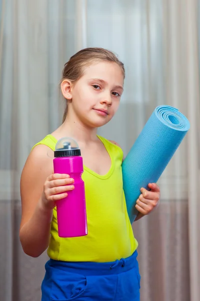 Active Child   holding exercise mat and water bottle in a home — 스톡 사진