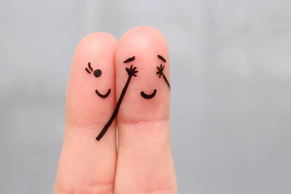 Finger art of a Happy couple. girl closed her eyes to boy. boy guessed who closed his eyes.