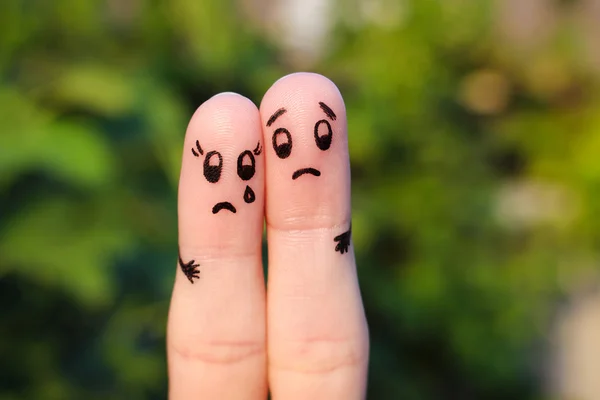 Finger art of displeased couple. Sad man soothe woman, she's crying.