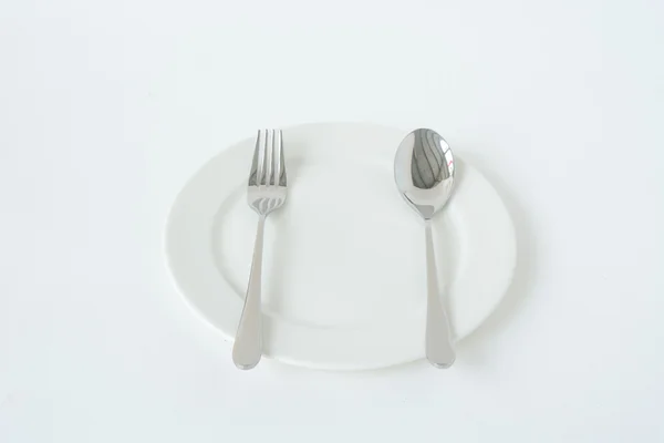 çatal ve kaşık beyaz tabakta