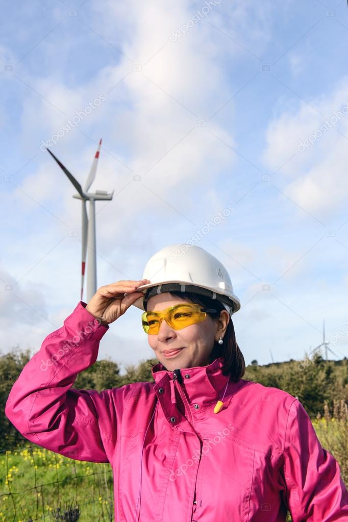 Woman engineer checking wind turbines.