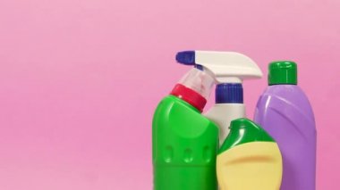 On the right are four bottles of cleaning detergent. Copy space on the left.