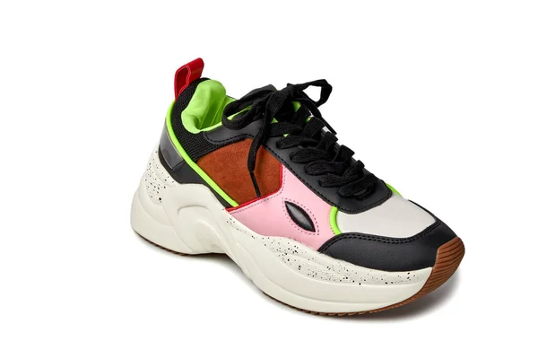 Close-up front view of the sneaker. Bright colors green, pink, black, brown. Stok Gambar