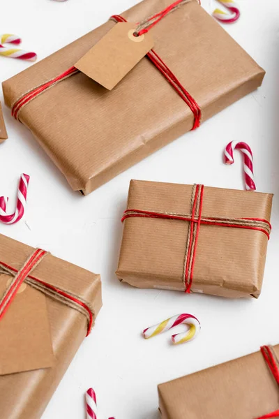 Christmas Gift Boxes Wrapped Craft Paper Red String Candy Canes — Stock Photo, Image