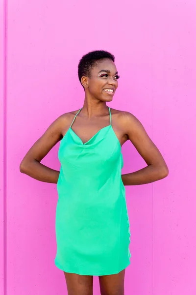 Happy Young Black Woman Green Dress Smiling Looking Away Pink — Stock Photo, Image
