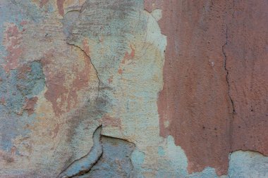 Evin sokak duvarında eski kahverengi alçı dokusu var. Sıcak gölgeler Eski Duvar dokusu