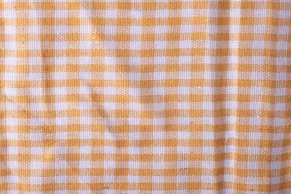 texture of beige plaid cloth dishcloth close-up.