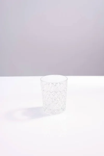 Empty Crystal Glass Beaker White Table Gray Background Minimalism — Stock Photo, Image