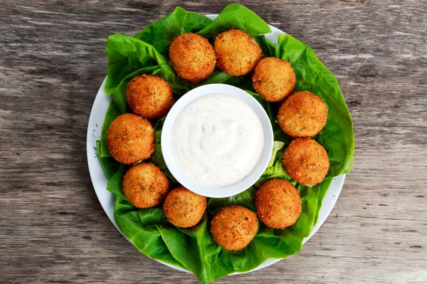 Fried mozzarella cheese stick balls with white sauce — Stock Photo, Image