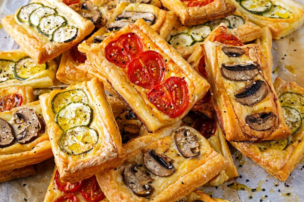 Puff pastry appetizers with vegetables, mushrooms, tomatoes, zucchini