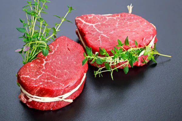 Fresh Raw Beef steak Mignon with thyme. — Stock Photo, Image
