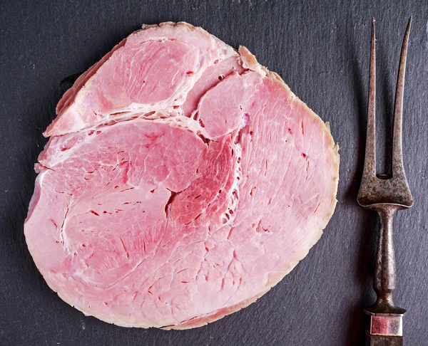 Wiltshire ham slices on stone board background — Stock Photo, Image