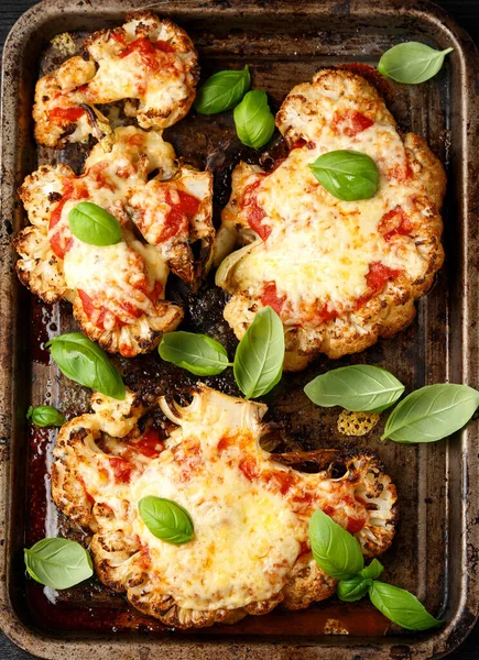 Baked Cauliflower steak with marinara sauce and cheese on rustic tray. Healthy vegetarian food — Stock Photo, Image