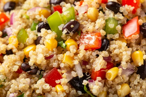 Quinoa black bean salad with corn, red green pepper, onion. Healthy food
